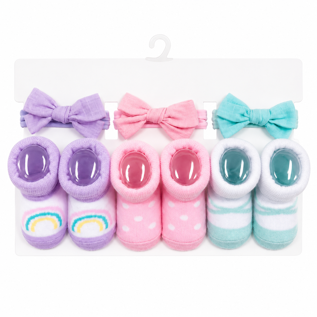 Otra vista del set coordinado de moños y calcetas Hudson Baby rosa con puntos para bebé